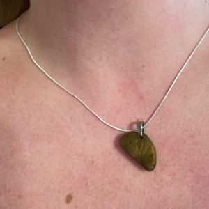 Unique shaped charm on silver chain